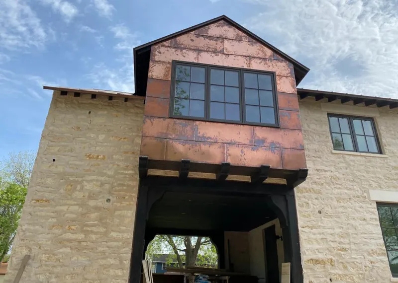 Copper metal panel facade on a stone building for Metal Roof Coating in Marietta